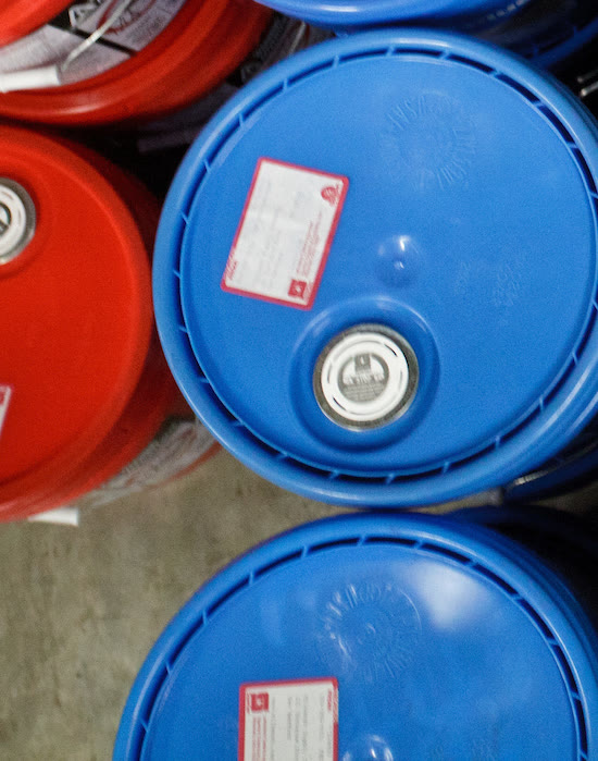 Blue and red 5 gallon buckets